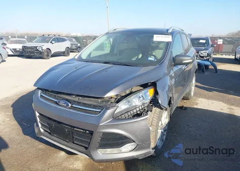 2014 Ford Escape Titanium z USA, uszkodzony, nr VIN 1FMCU0JX4EUB28783